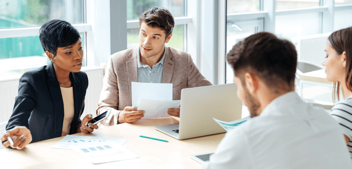 graphicstock-multiethnic-group-of-young-businesspeople-working-together-on-business-meeting-in-conference-room_r_fwTfQB2l.png